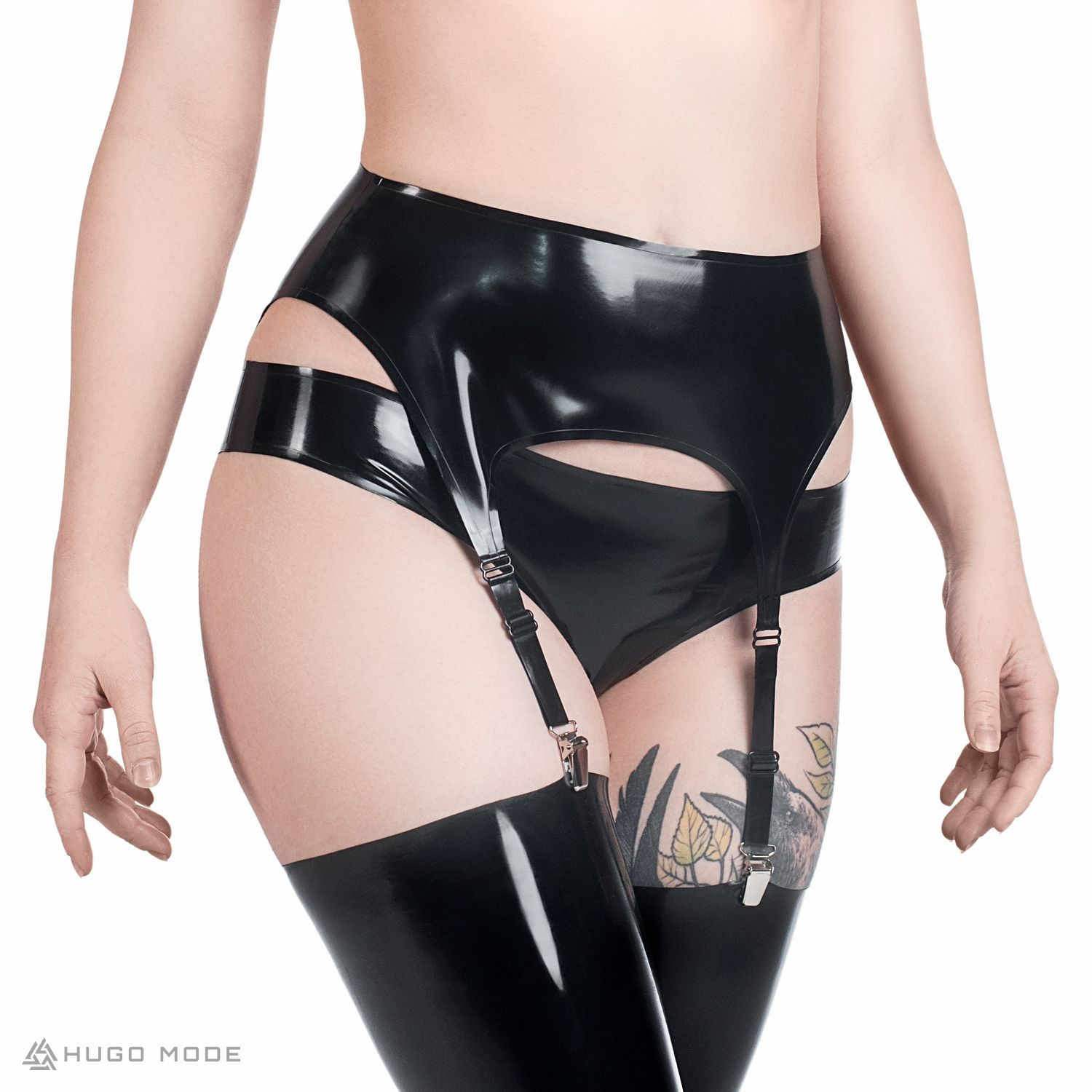 A black latex garter belt with reinforced edges and four garter straps for fastening stockings.