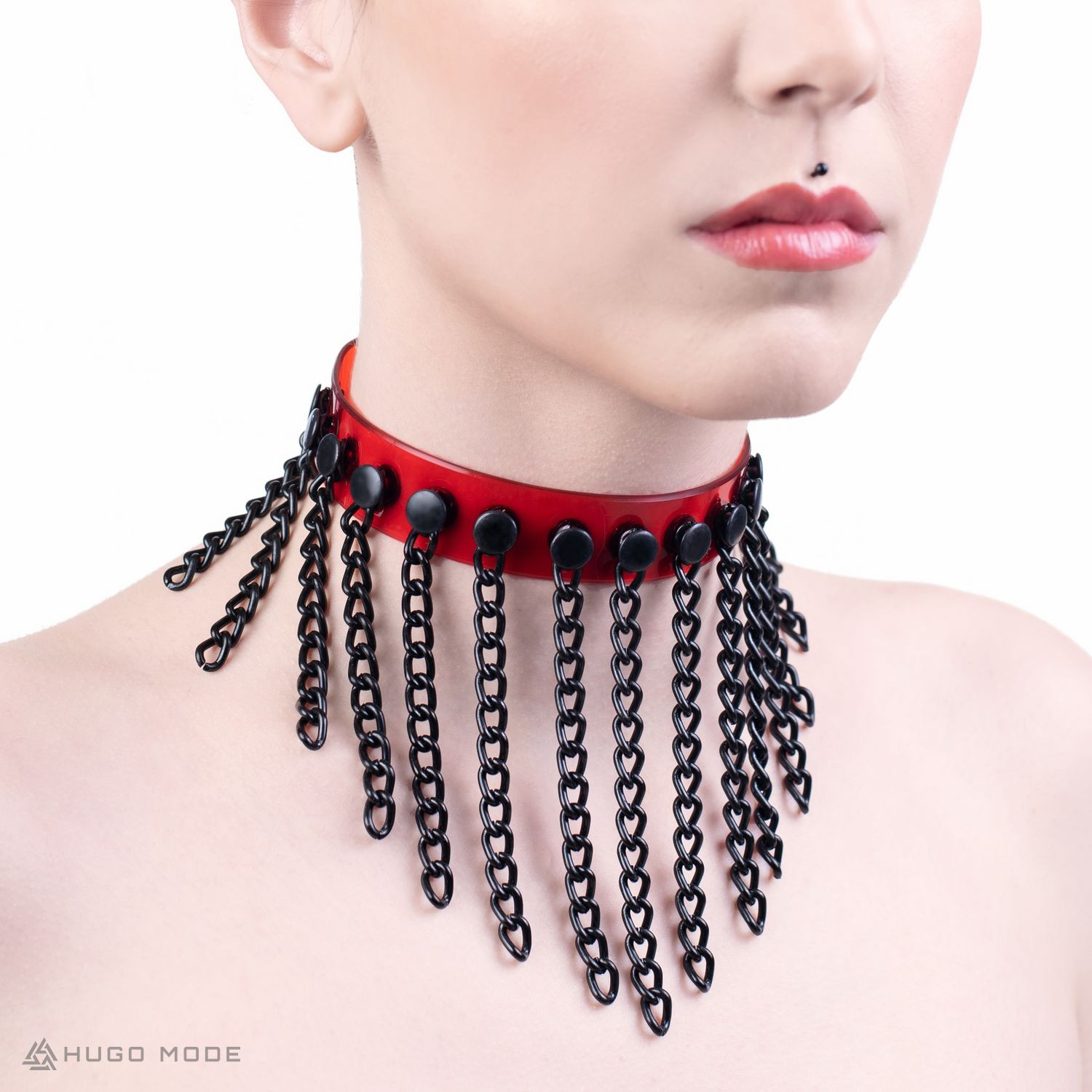 A choker decorated with long black chains in various lengths.